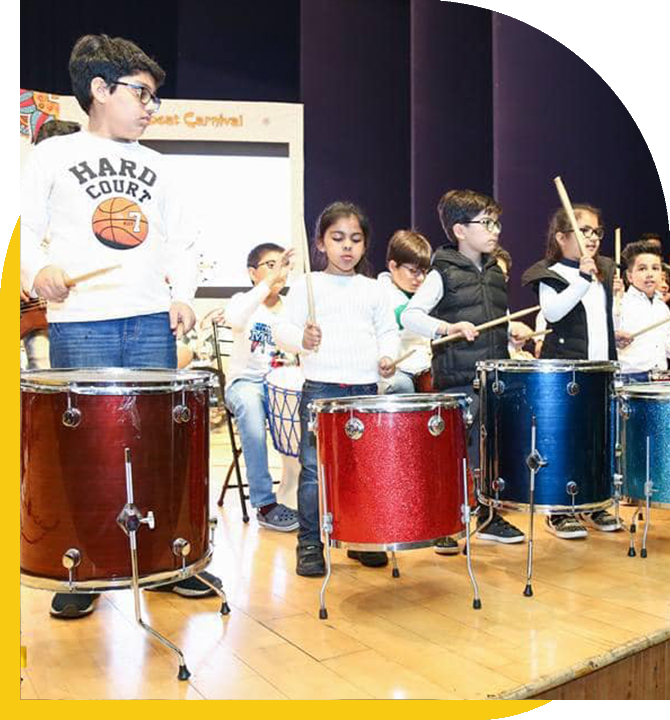 Children Performing on Stage and Playing Musical Instruments